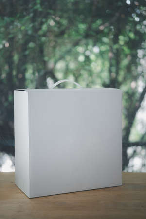 White package with a handle on wood tableの写真素材