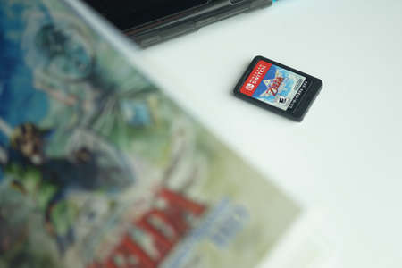 Samut Prakan, Thailand - August 15, 2021 : The new game cartridge of the Nintendo Switch video game...