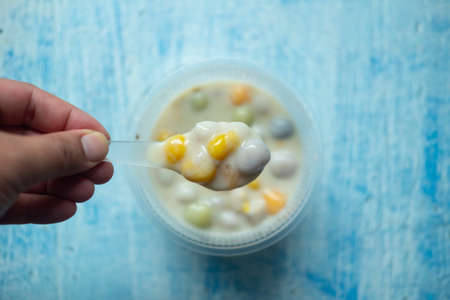 Take a spoon Bua Loy, tricolor coconut milk dessert Thai dessert. Bua loy is the best dessert menu...