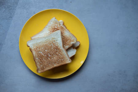 Homemade of slice toast on yellow dish. Healthy diet breakfast concept