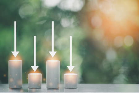 Simple wooden block financial bar chart graph with arrow down in graph, resulting in profit and loss, risk management business financial and management conceptの写真素材