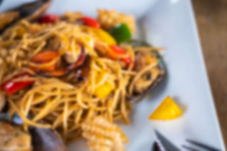 Blur background of seafood spaghetti. Food background menuの写真素材