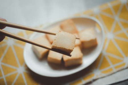 Fried fish tofu with chopstick. Close upの写真素材