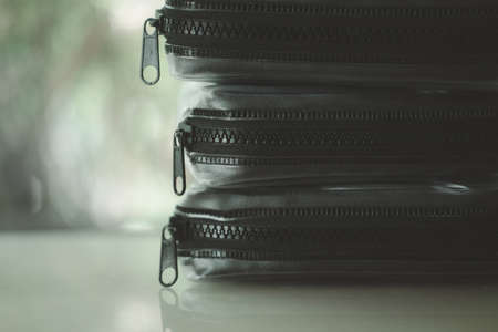 Zipper on three mini travel bag kit. Close upの写真素材