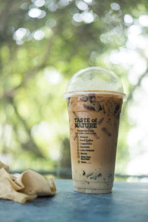 Samut Prakan, Thailand - September 11, 2021 : Thai Milk Tea with grass jelly against nature background from cafe amazon coffee in Thailandのeditorial素材