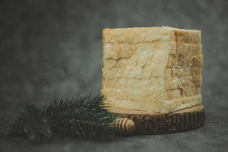 A stack of delicious slice of bread on black backgroundの写真素材