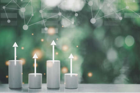 Bar graph made of blocks with arrow up. Successful business bar graph with rising up arrowの写真素材