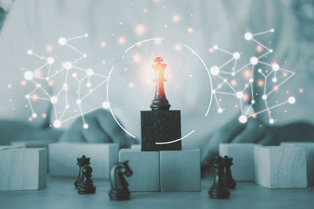 Target locked of black chess for competition and strategy with businessman in background. Strategic plan for business development.の写真素材