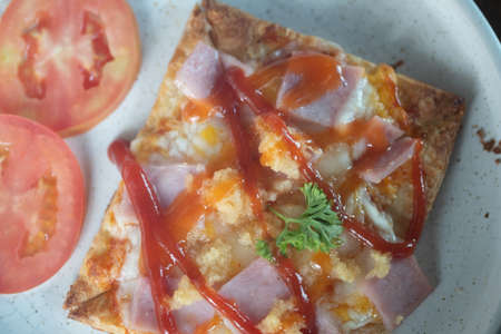 Toast topping with bacon and chili sauce, ketchup, breakfastの写真素材