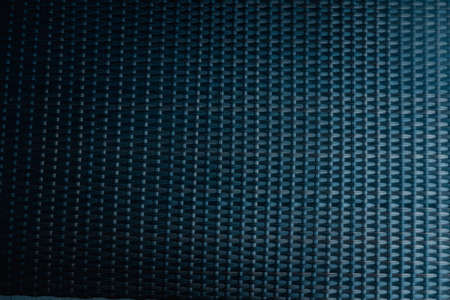 Background Black wicker plastic table mat. Outdoor furniture and abstract background conceptの写真素材