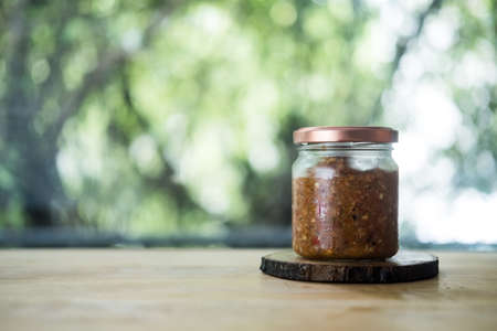 Chili paste mix with mackerel in glass bottle. Thailand food menuの写真素材