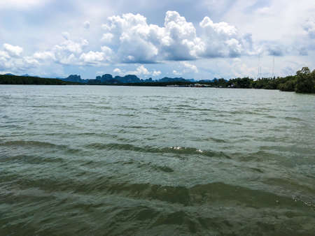 Cloudy sky and river. Take a photo from boatの写真素材