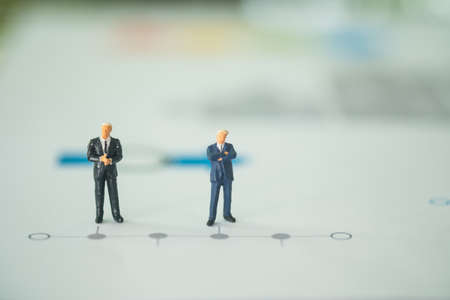 Miniature people businessman stand on a business horizontal timeline process chart. The concept of strategy, timelineの写真素材