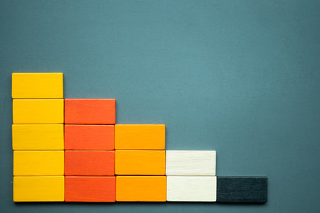 Market data chart graph made of wooden colorful toy blocks. Depicts increasing of productivity or challenging amount on the competitive marketの写真素材