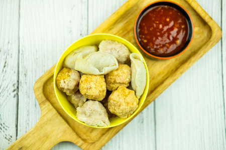 Many steam meatball in yellow bowl served with sweet sauce. Thai appetizer styleの写真素材