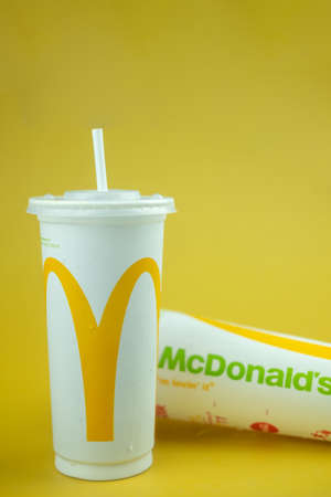 Samut Prakan, Thailand - October 24, 2021 : McDonald's plastic cup of iced drink from the McDonald's...