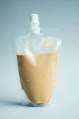 Iced coffee in transparent bag for keep drink in home. Close up