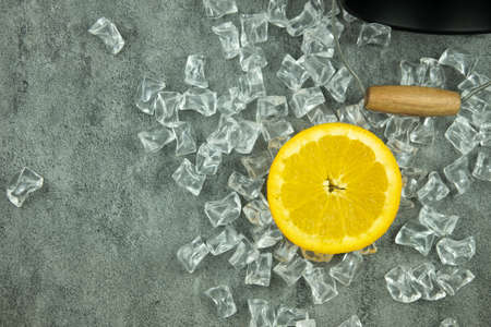 Slice of lemon fruit on acrylic ice cubes. Top viewの写真素材