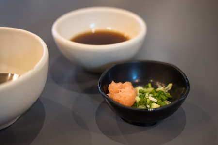 Orange grated radish with chopped spring ready for mix with ponzu japanese sauceの写真素材