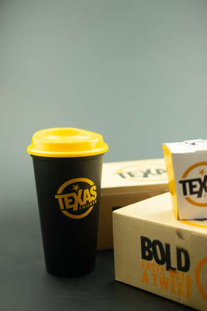 Samut Prakan, Thailand - November 21, 2021 : Texas Chicken SOFT DRINK in a new tumbler with selective focus.のeditorial素材