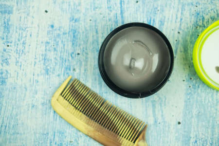 A box of hair wax with a comb for men. Top viewの写真素材