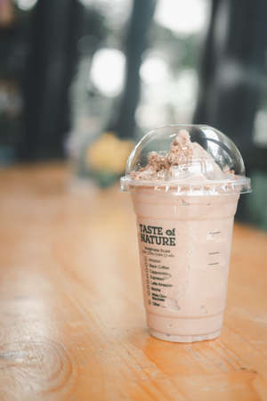 Bangkok, Thailand - December 7, 2021 : Caramel Mocha Frappe with KitKat (Cafe Amazon x Kit Kat) on a table at Amazon cafe. Amazon brand coffeehouse at PTT Gas station.のeditorial素材