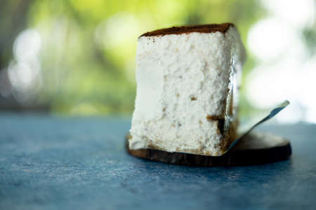 A fresh piece of cream cake on the back.の写真素材