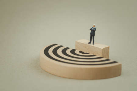 Miniature businessman standing and see maze. Business idea concepts troubleshooting analysis of problems to find solutions.の写真素材