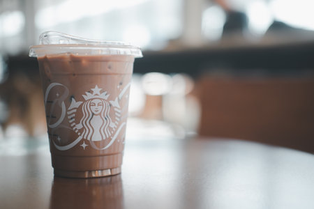 Samut Prakan, Thailand - December 15, 2021: Glass of Starbuck coffee iced mocha on a table. Starbucks is the world's largest coffee house with over 20,000 stores in 61 countries and is highly popular.のeditorial素材