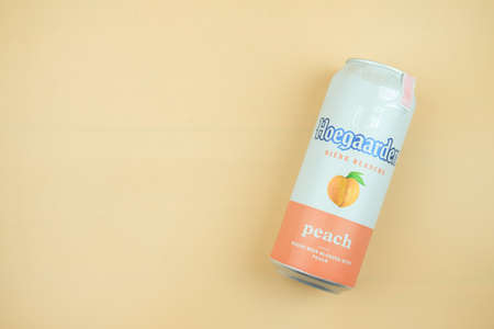 Samut Prakan, Thailand - December 15, 2021 : A can of Hoegaarden peach flavored, wheat beer blended...