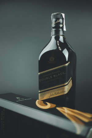 Bangkok, Thailand - December 15, 2021 : A bottle of Johnnie Walker Double Black Whisky. Johnnie Walker is a brand of Scotch whisky owned by Diageo that originated in Kilmarnock, Ayrshire, Scotland.のeditorial素材