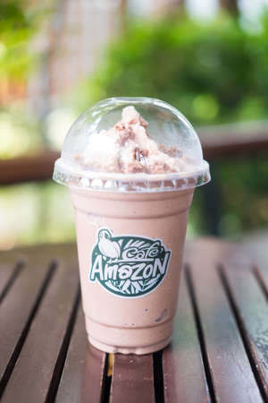 Bangkok, Thailand - December 22, 2021 : Caramel Mocha Frappe with KitKat (Cafe Amazon x Kit Kat) on a table at Amazon cafe. Amazon brand coffeehouse at PTT Gas station.のeditorial素材