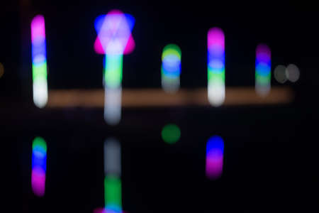 Blur background of light beam fluorescent light colorful in dark background