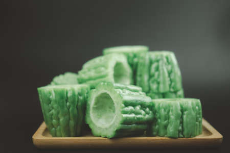 A stack sliced bitter gourd ready to cooking, bitter gourd is a plant that gets its name from its tasteの写真素材