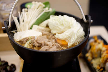 Japanese beef hot pot with vegetable, tofu, and mushrooms. Sukiyakiの写真素材