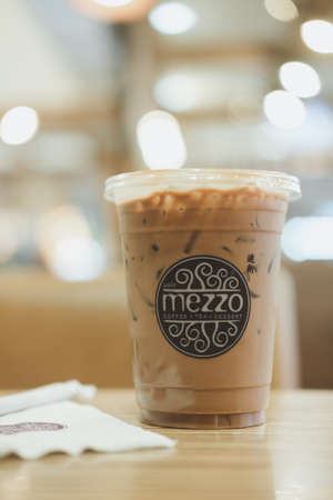 Samut Prakan, Thailand - January 1, 2022 : A small plastic cup iced mocha of Mezzo brand are put on...