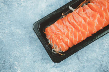 Fresh raw salmon sashimi. Online order food and delivery concept. Selective focusの写真素材