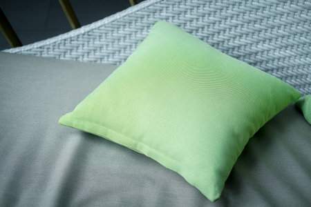 Green bright pillow on sofa in living roomの写真素材