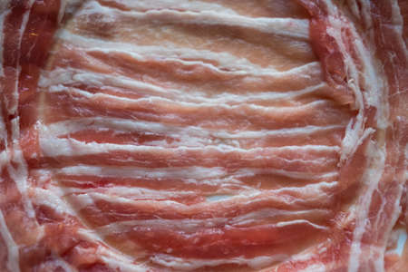 Thinly sliced of raw pork for Japanese hot pot also known as Shabu Shabu or Sukiyaki is Japanese...