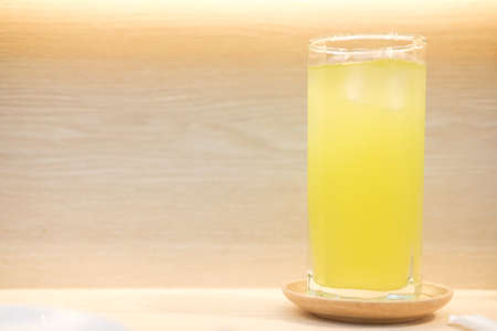 Green tea with ice on wood table.の写真素材