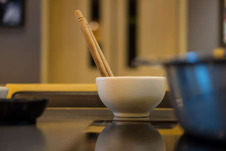 Close of white bowl for eating shabu or sukiyaki.の写真素材