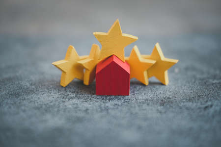 Wood red home with yellow star rating feedback and press level excellent five rank for giving best score. Customer Experience, feedback.home loan house mortgage agent.の写真素材