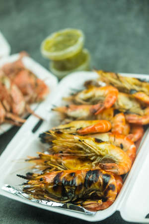Grilled river shrimps in take home foam box, most favorite food in Thailadnの写真素材