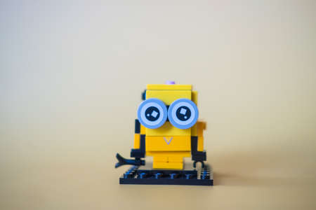 Bangkok, Thailand - February 6, 2022 : A cute LEGO minions built with LEGO bricks my hobbies on a yellow backgroundのeditorial素材