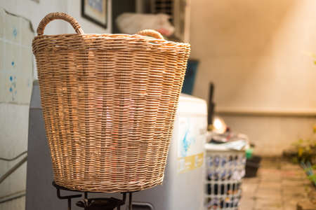 Wicker basket near washing machine. Close upの写真素材