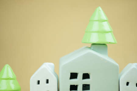 Christmas little tree on the chimney. Miniature cozy home, season greeting. Festive decorの写真素材