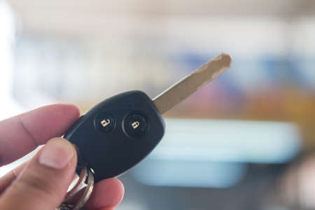 Man holding a car key. Designated driver concept car rental holdingの写真素材