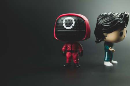 Samut Prakan, Thailand - March 28, 2022 : POP Television : Squid Game. Your favorite characters from the South Korean Netflix series on a black background.のeditorial素材