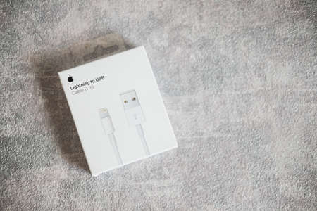 Samut Prakan, Thailand - April 2, 2022 : Apple lightning to usb cable with original package. Apple cable for devices connections. Electronics.のeditorial素材
