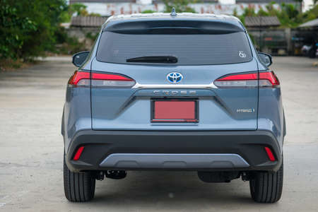 Samut Prakan, Thailand - April 2, 2022 : Back view of a new car Toyota Corolla Cross car with 1.8 litre hybrid engine celestite gray metallic. The latest Toyota's SUV. Hybrid engine 4th generation.のeditorial素材